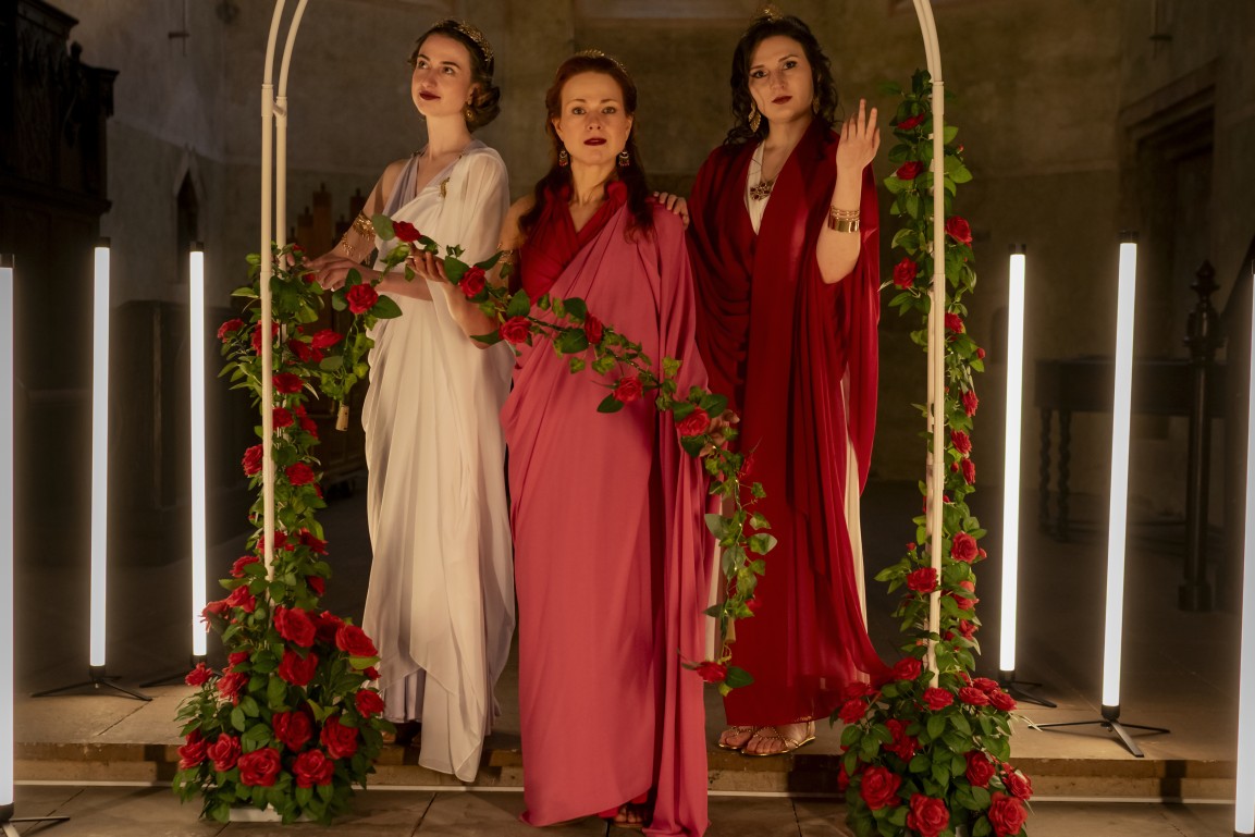 Three singers performing the Baroque programme in a historic church